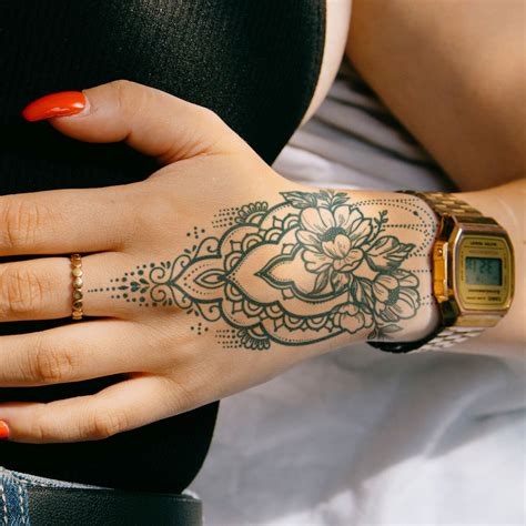 mandala hand tattoos